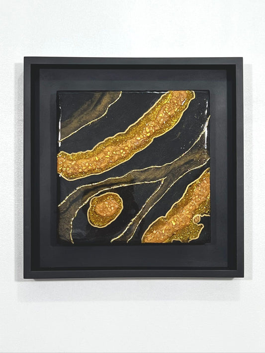 12" x 12" Black and Gold Resin Geode wall art in black wood frame.